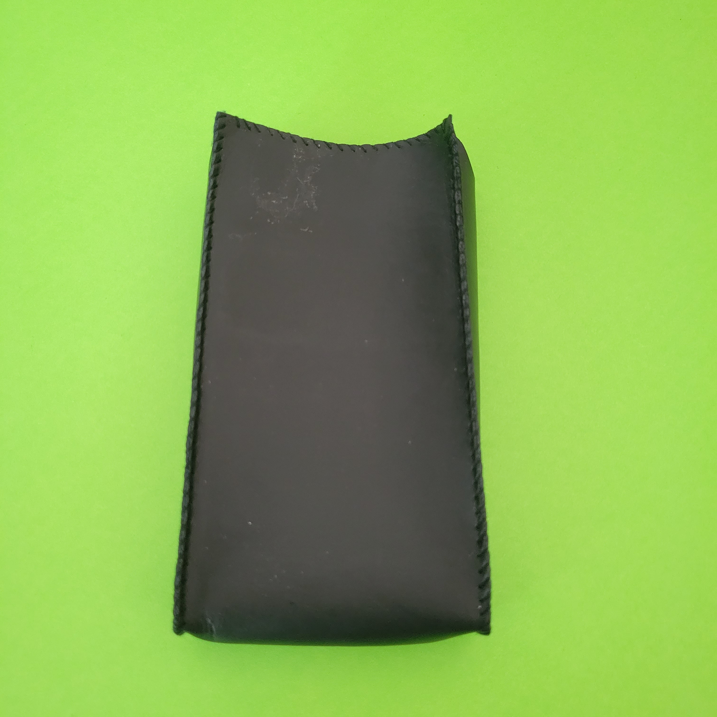 An image of the case of a Microlith Four function plus calculator